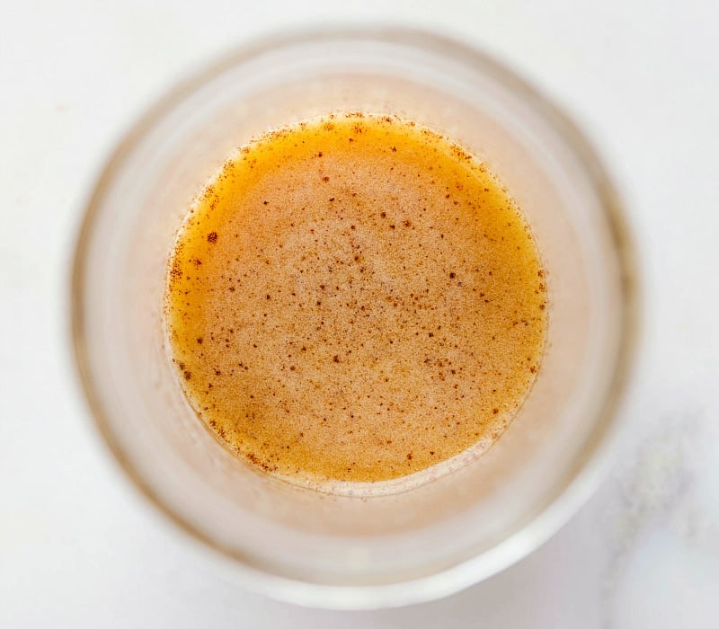 Apple cider vinaigrette dressing in a mason jar, a delightful addition to your salad.