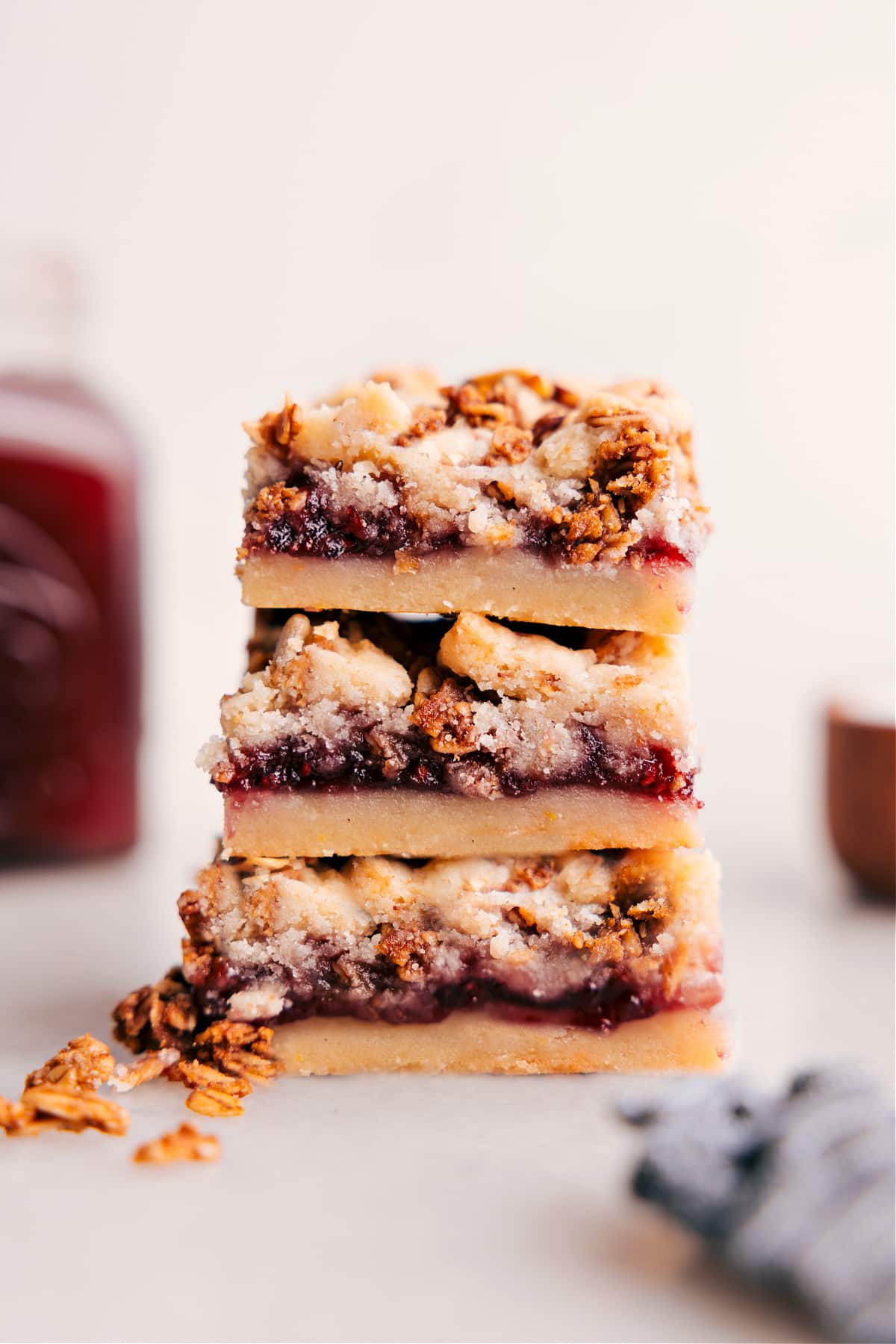 The Best Raspberry Bars Ever Stacked Raspberry Bars showing off the yummy layers.
