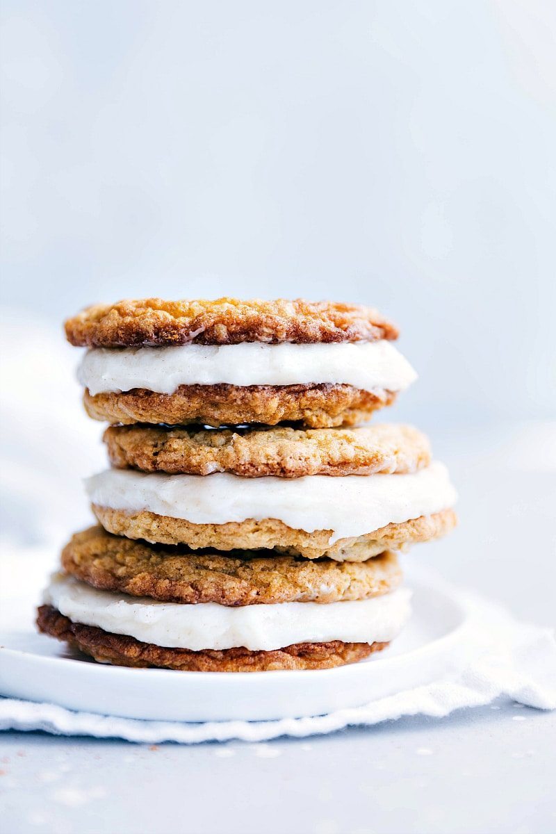 The best ever homemade OATMEAL CREME PIES! Delicious and easy to make! I chelseasmessyapron.com Three Oatmeal Creme Pie cookies stacked on a plate