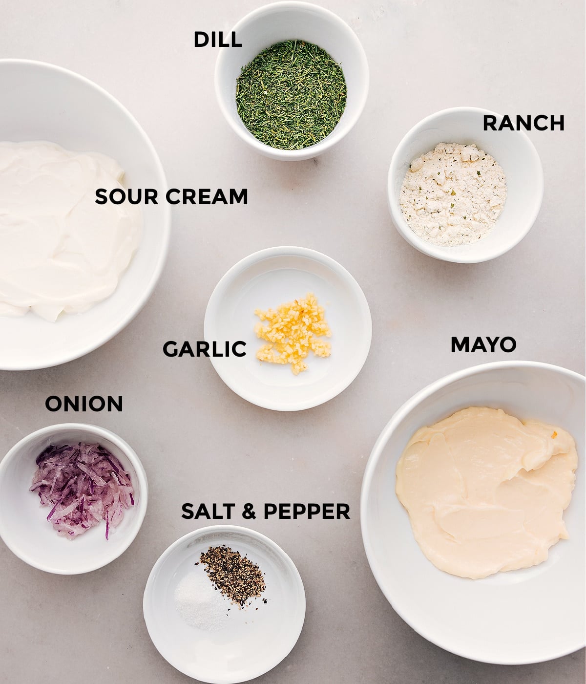 Ingredients In Veggie Ranch Dip All the ingredients for this recipe—dill, ranch seasoning, sour cream, mayo, garlic, onion, salt, and pepper—are prepped and ready for easy assembly.