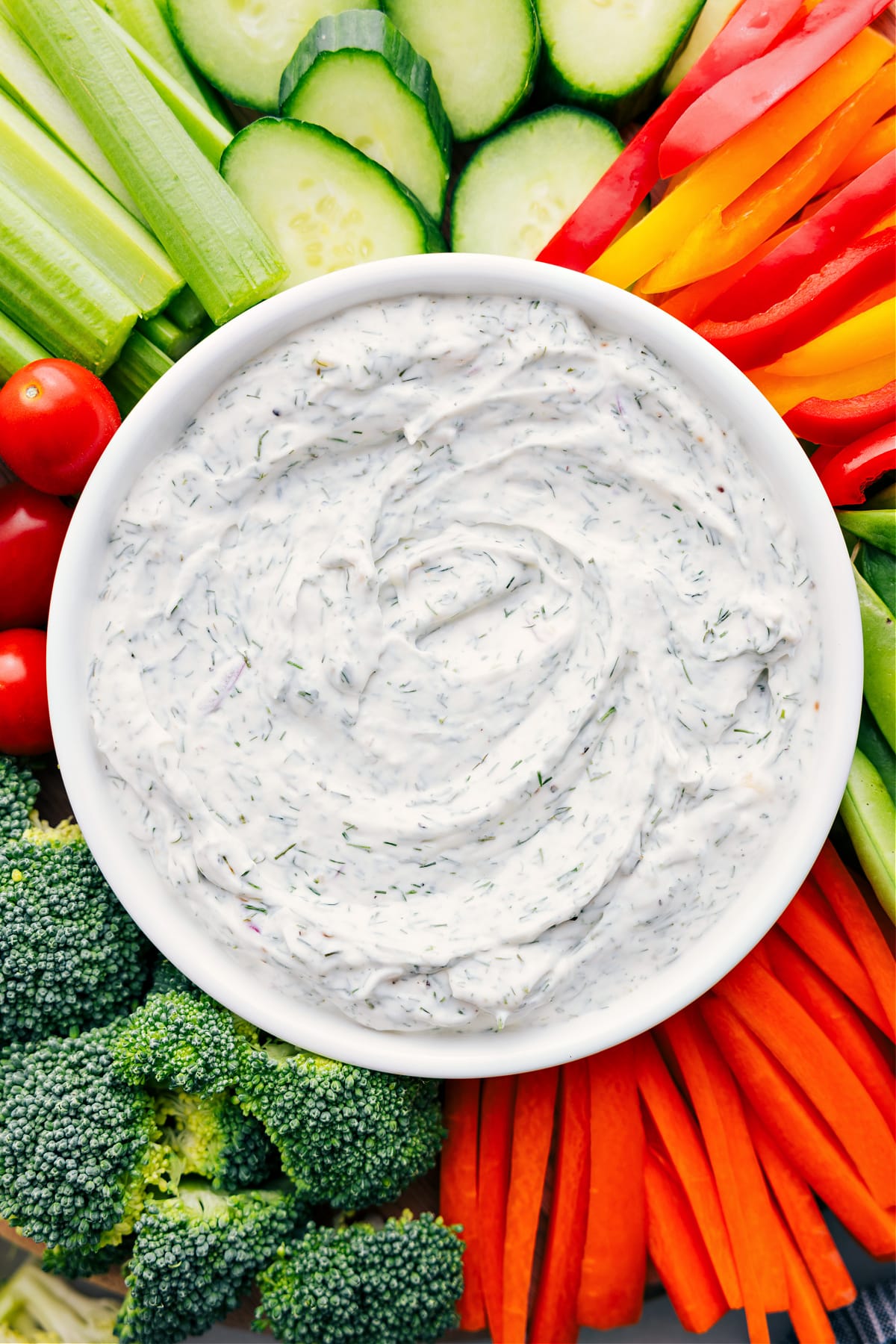 The Best Veggie Dip Recipe Veggie Dip in a bowl surrounded by fresh veggies, ready for dipping and enjoying!