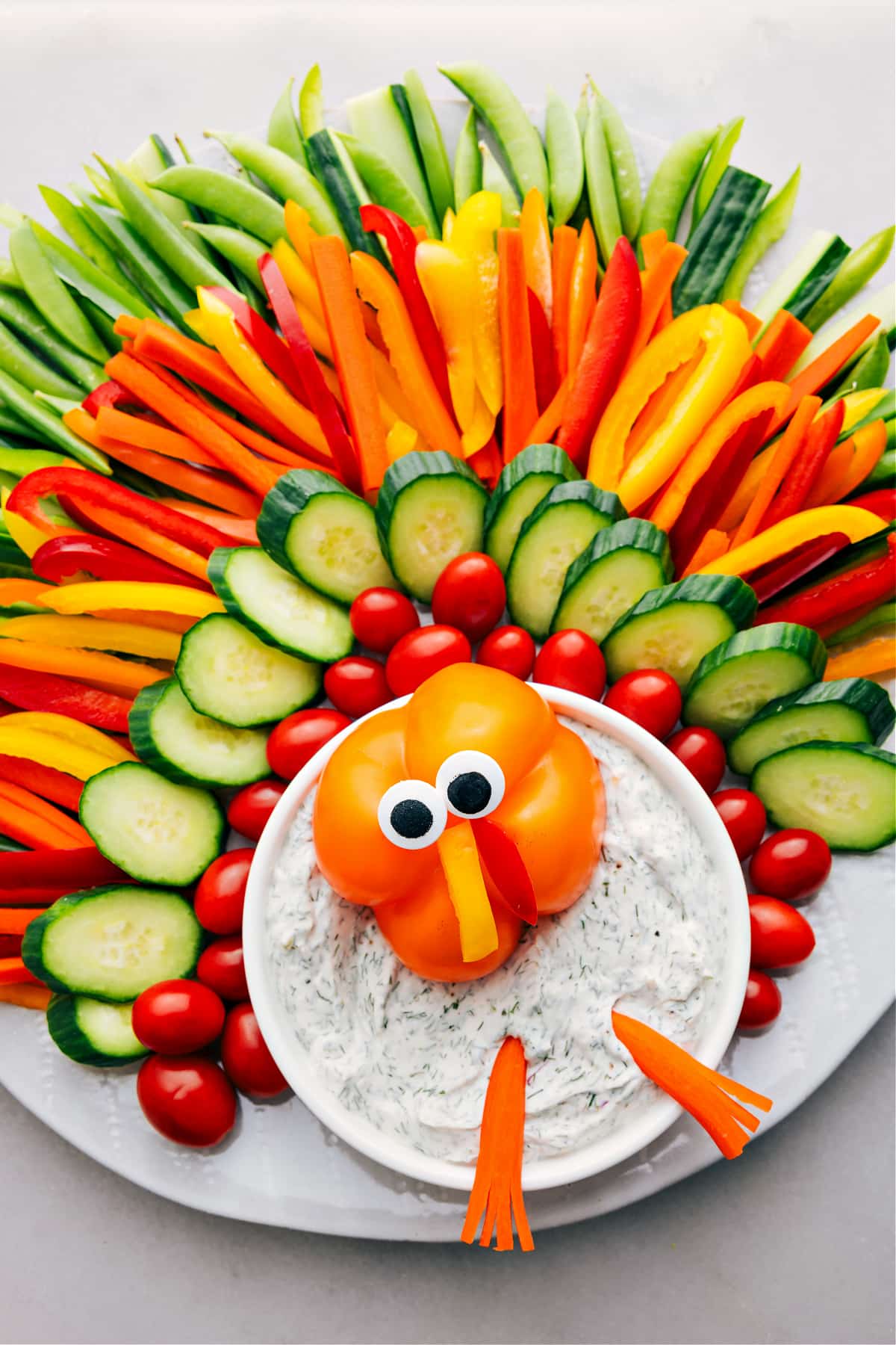 Turkey Veggie Dip Recipe Vegetables arranged to look like a turkey make a fun Thanksgiving appetizer option.