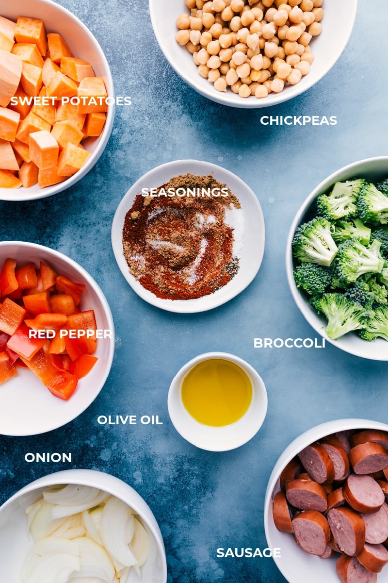 Sausage and Chickpeas are tossed with onions, sweet potatoes, broccoli, and a sweet bell pepper in an unforgettable Mexican-inspired seasoning blend. This meal is prepared on one sheet pan requiring minimal prep time and even quicker clean-up! Recipe via ChelseasMessyApron #broccoli #onions #peppers #sausage #chickpeas Ingredient shots-- image of all the components for this dish