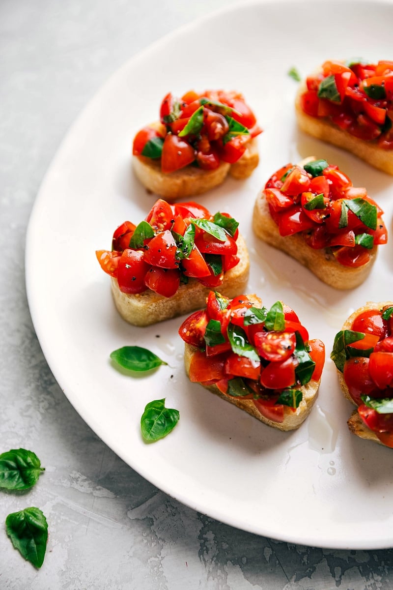 Authentic Italian Bruschetta Al Pomodoro -- this recipe came straight from Italy along with all the tips and tricks we're sharing! Recipe via chelseasmessyapron #appetizer #snack #quick #easy #simple #thanksgiving #christmas #newyearseve #familyfriendly #tomatoes #bruschetta