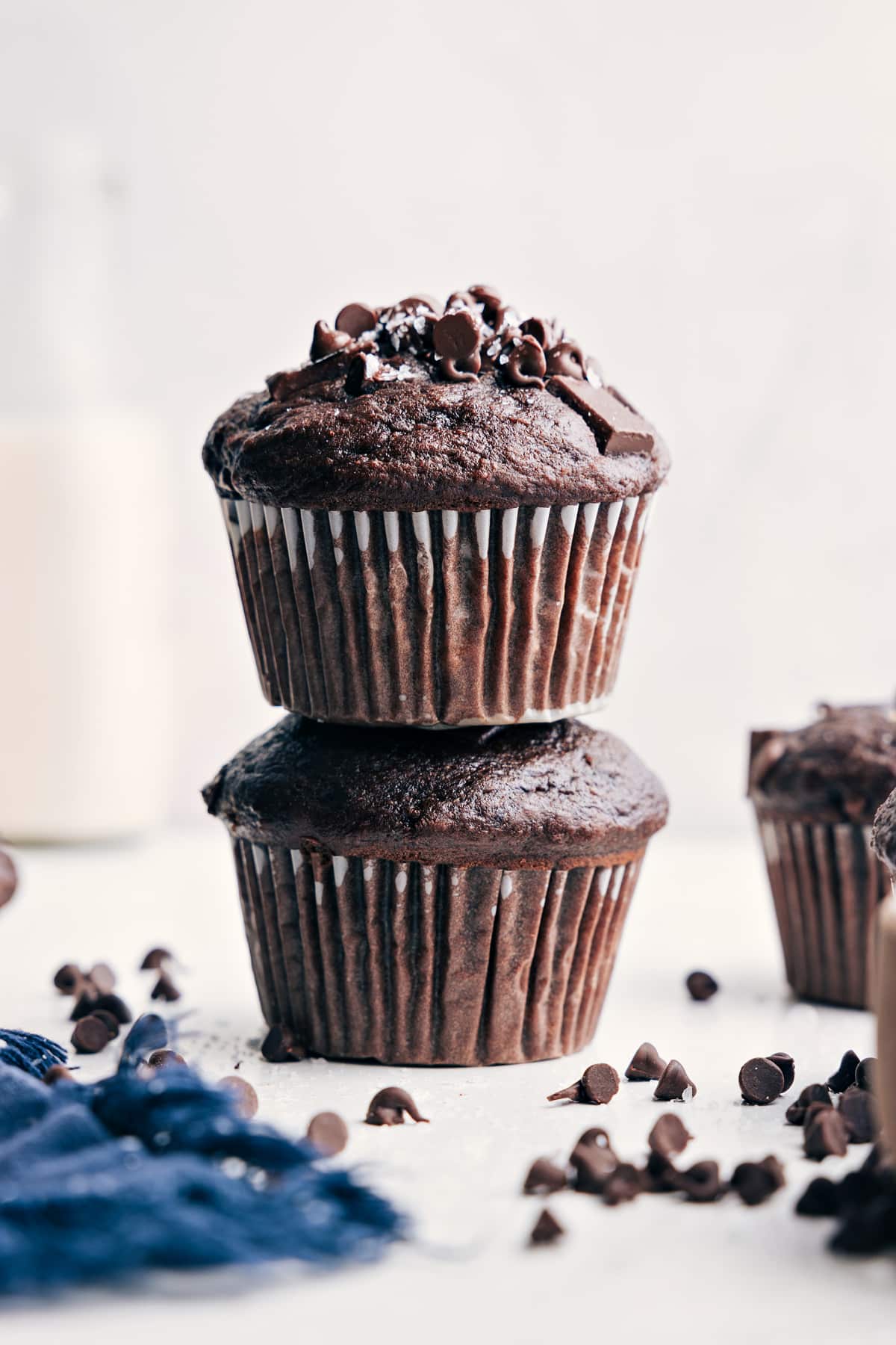 The best ever Chocolate Banana Muffins! These muffins are made with more nutritious ingredients than your typical bakery-style muffins; they've got Greek yogurt, bananas, coconut oil, and a lot less sugar than other recipes. Even though we're using better ingredients, we aren't sacrificing any flavor with this recipe! Recipe via chelseasmessyapron #breakfast #dessert #best #quick #easy #simple #chocolatechips #chocolate #banana #muffins