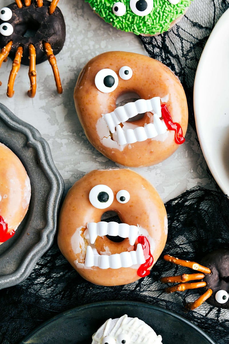 Vampire Halloween Donut with Eye Sprinkles and Fake Vampire Teeth Vampire variation with eye sprinkles and fake vampire teeth.