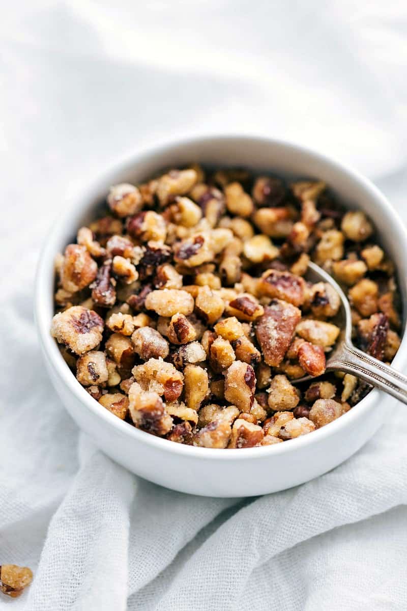 A feel-good roasted veggie dinner! You won't miss the meat in these roasted butternut squash couscous bowls with pecans, avocado, couscous, and a delicious sauce. This recipe will also teach you how to roast the PERFECT butternut squash! After testing several ways to prepare butternut squash, this method is our favorite! via chelseasmessyapron.com #perfect #tried #tested #easy #roasted #butternut #squash #best #quick #simple #vegetarian #meal #dinner #fall #recipe #healthy #avocado #benefits #arugula #mustard #dressing