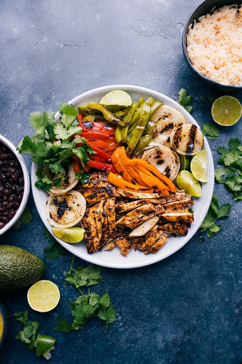 The best chicken fajita marinade recipe with all the fixings for a delicious dinner prepped out.