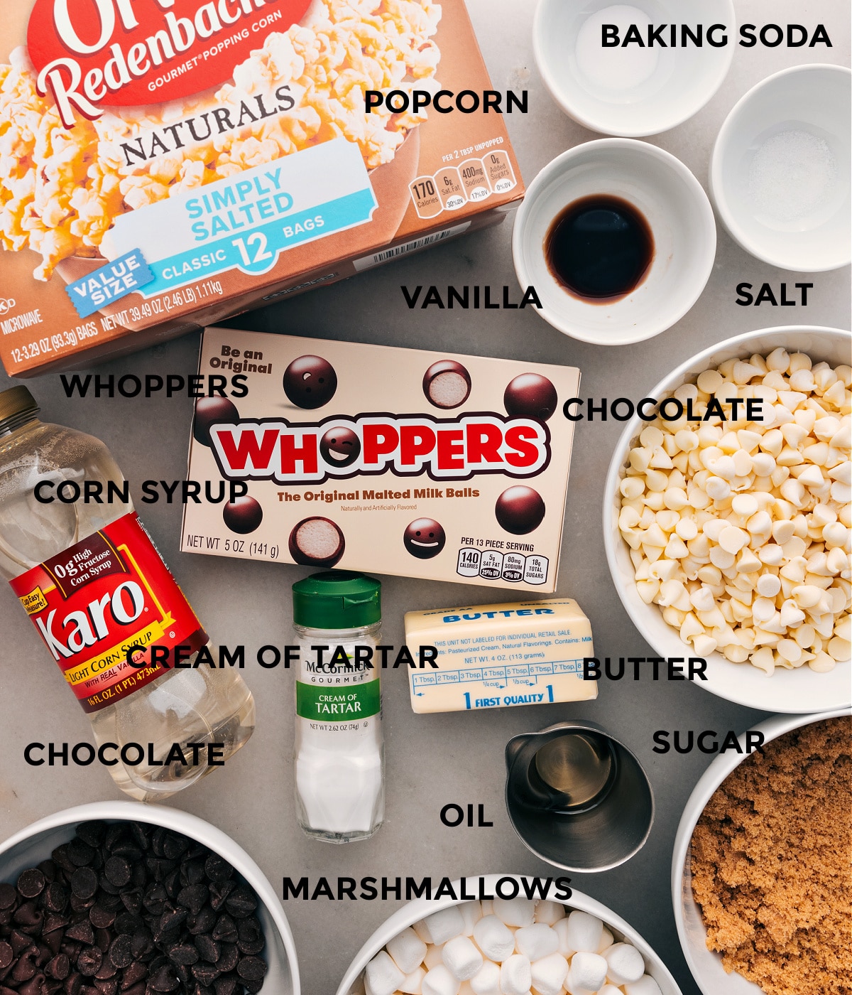 Ingredients In Gourmet Chocolate Popcorn All the ingredients in this recipe are prepped for easy assembly: baking soda, salt, vanilla, popcorn, Whoppers, chocolate, cream of tartar, sugar, corn syrup, and butter.
