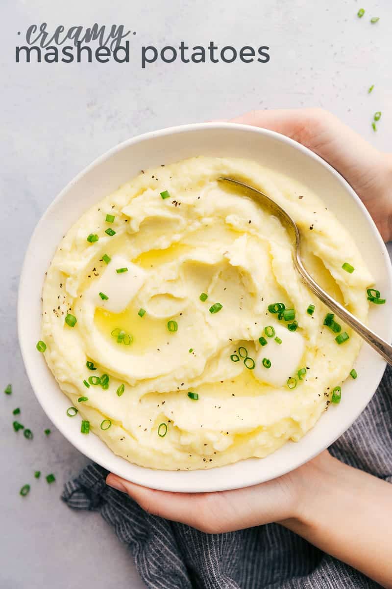 This rich and creamy Mashed Potatoes recipe also includes tips and tricks on how to make the BEST Mashed Potatoes. Mashed Potatoes in a bowl topped with green onions.