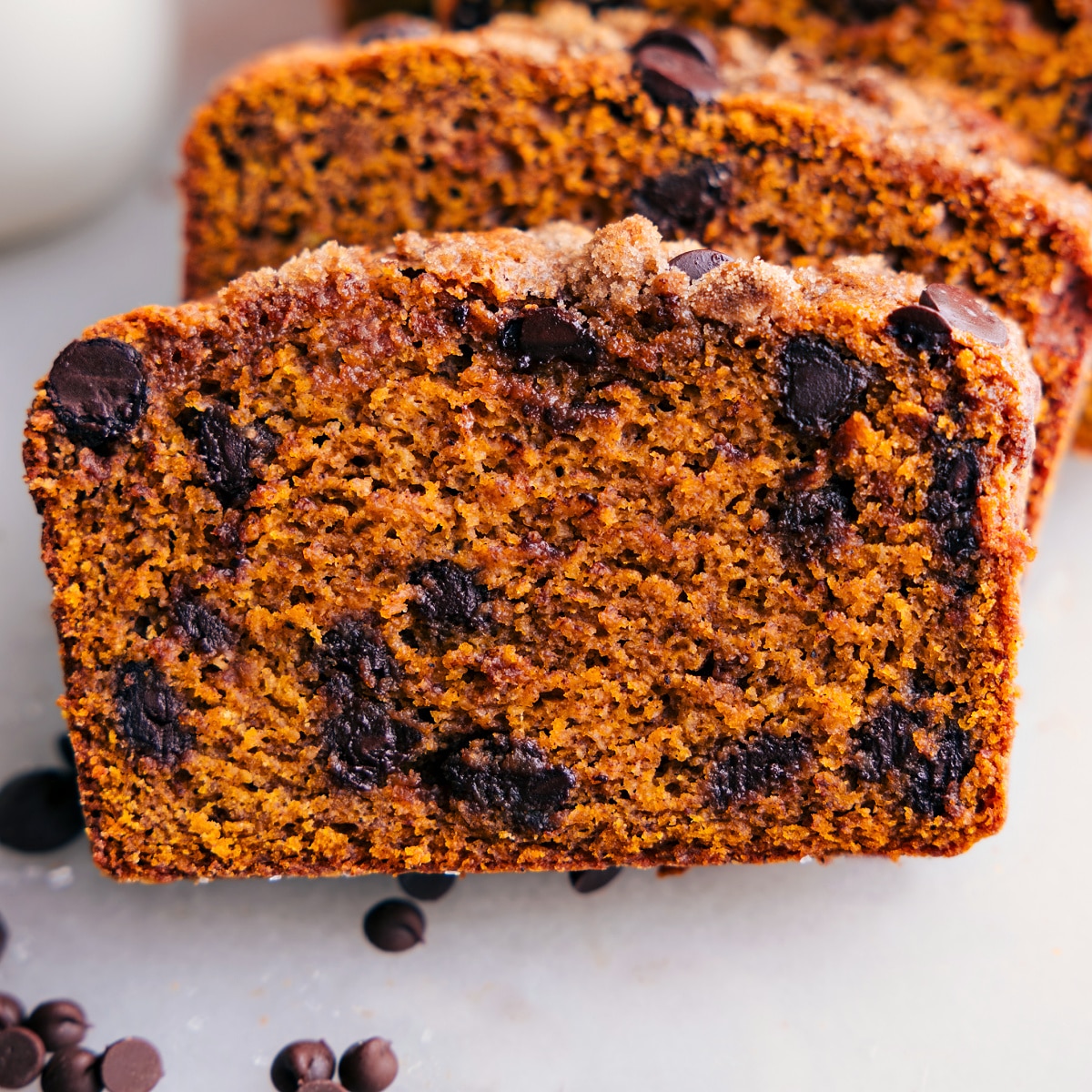 Delicious and Moist Pumpkin Bread Slice with Chocolate Chips Delicious moist pumpkin bread, with chocolate chips throughout.