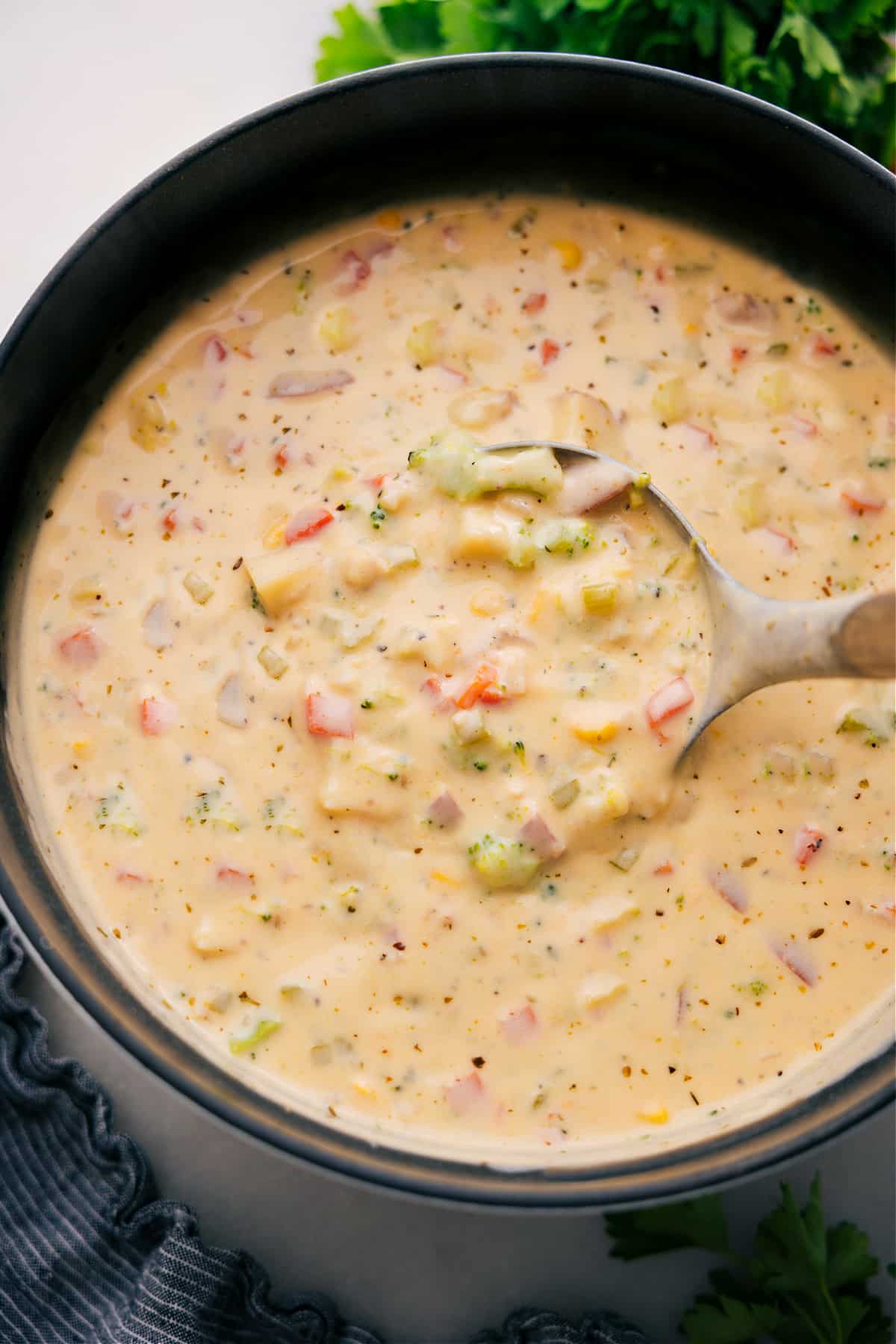 One Pot Creamy Vegetable Soup Recipe A pot of creamy vegetable soup with a ladle, ready to enjoy.