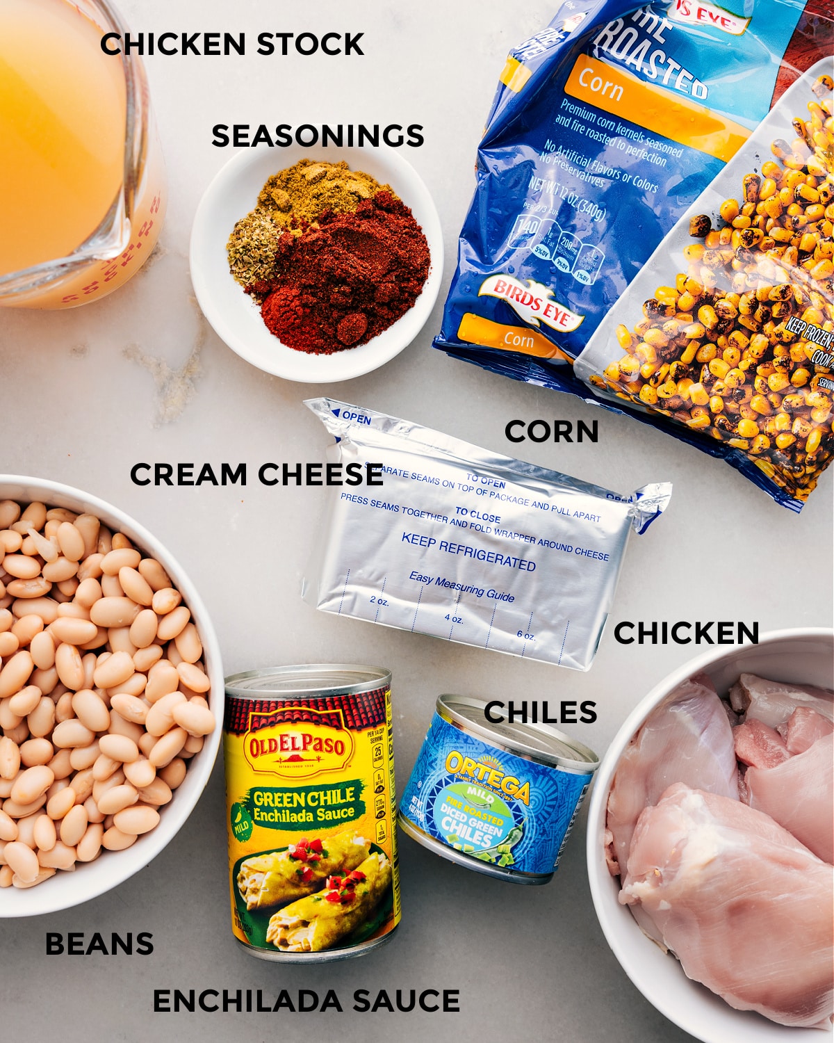 Ingredients In Crockpot White Chicken Chili Prep all the ingredients for this recipe, including stock, seasonings, corn, cream cheese, meat, chiles, beans, and enchilada sauce, for easy assembly.