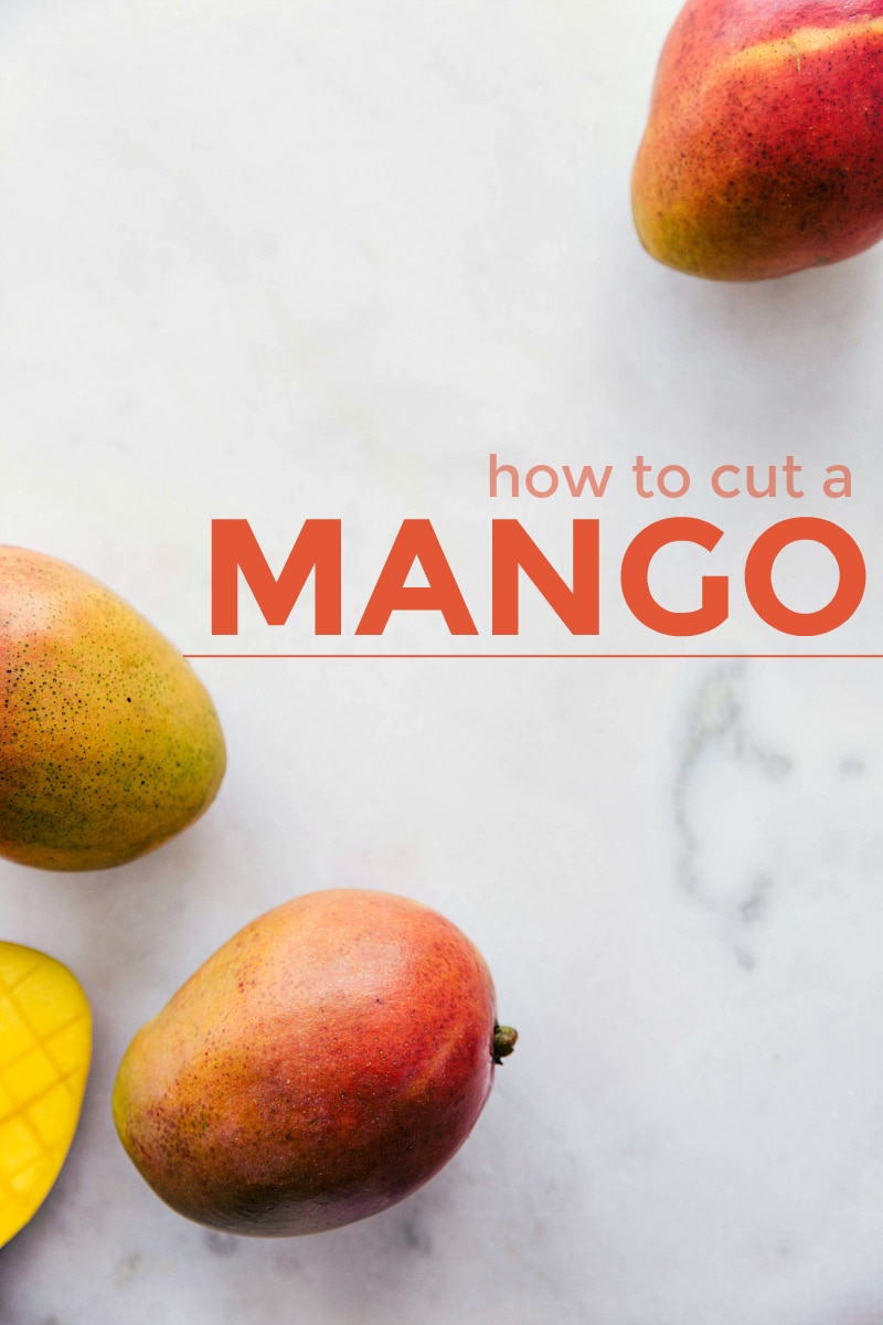 Step by step visual guide on how to cut a mango into cubes or strips. Plus, all your questions about mangoes answered and plenty of ways to use them! Recipe via chelseasmessyapron #withapit #intoslices #cubes #easy #hacks #withaseed #fun #howtocutamango Image of mangoes on a marble board with text "how to cut a mango" across image