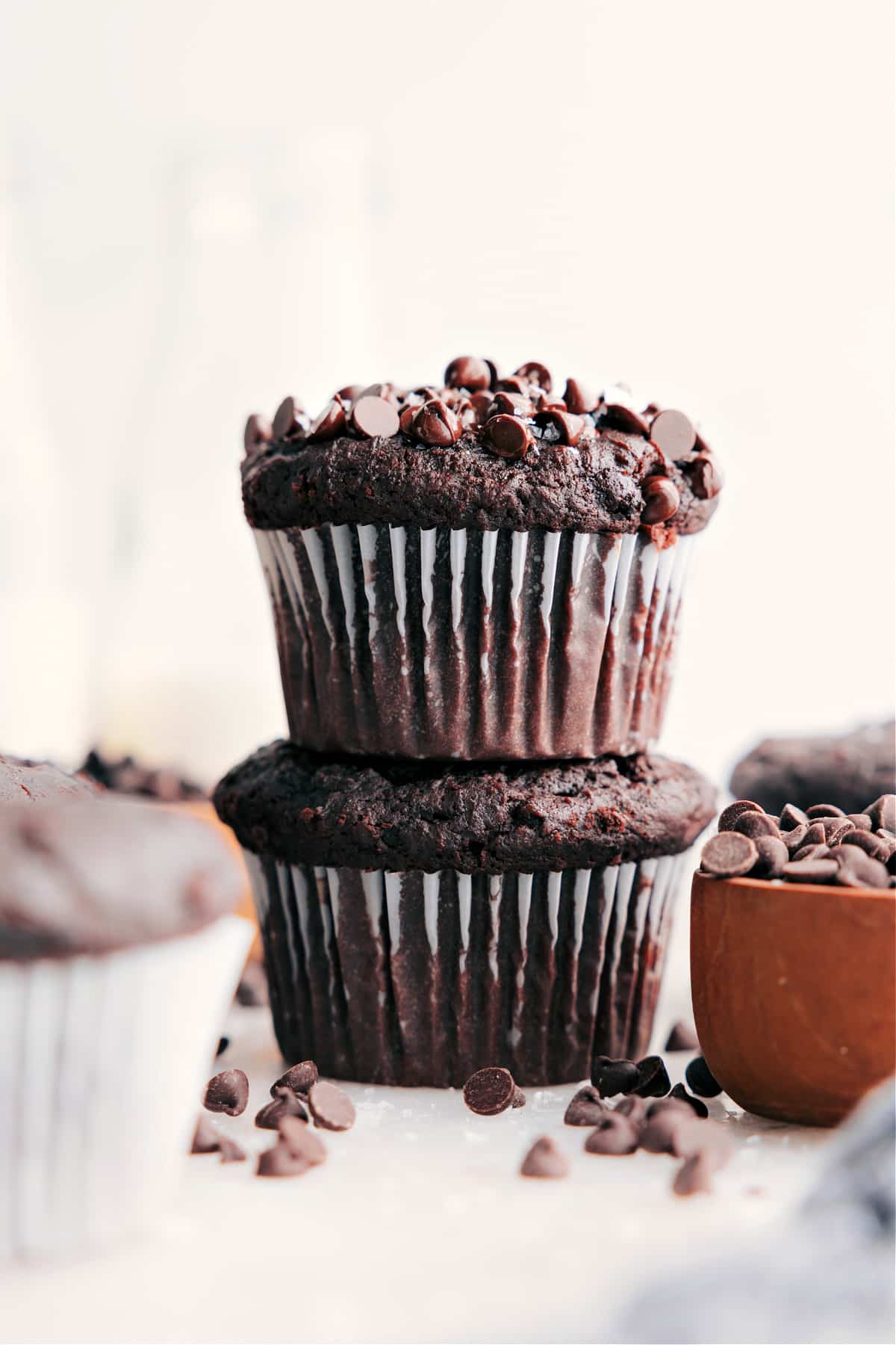 The Best Chocolate Muffins Recipe Chocolate Muffins stacked and ready to enjoy.