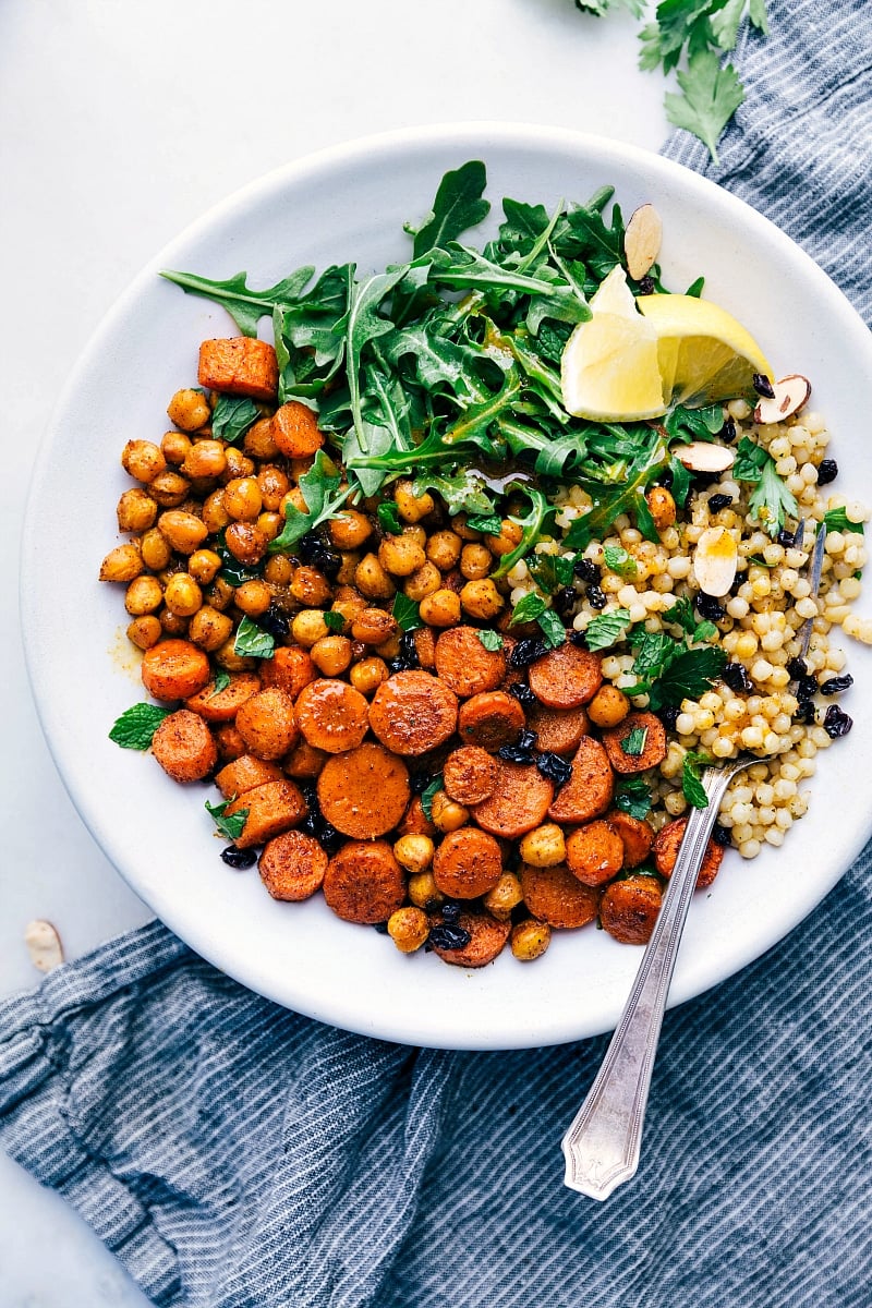 Moroccan Carrot Salad is packed with flavor and healthy ingredients. From the roasted seasoned carrots and chickpeas to the garlicky couscous and citrus dressing, every bite is a treat! Moroccan Carrot Salad