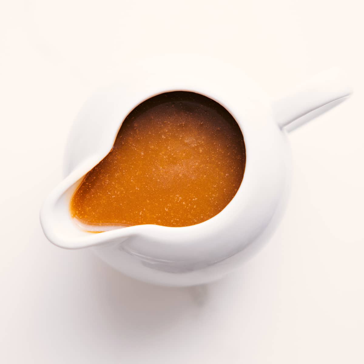 This simple stovetop Vanilla Sauce requires only five ingredients and less than 10 minutes prep time! Recipe via chelseamessyapron #forbreadpudding #easy #recipe #desserts #forwaffles #forpancakes #vanilla #sauce