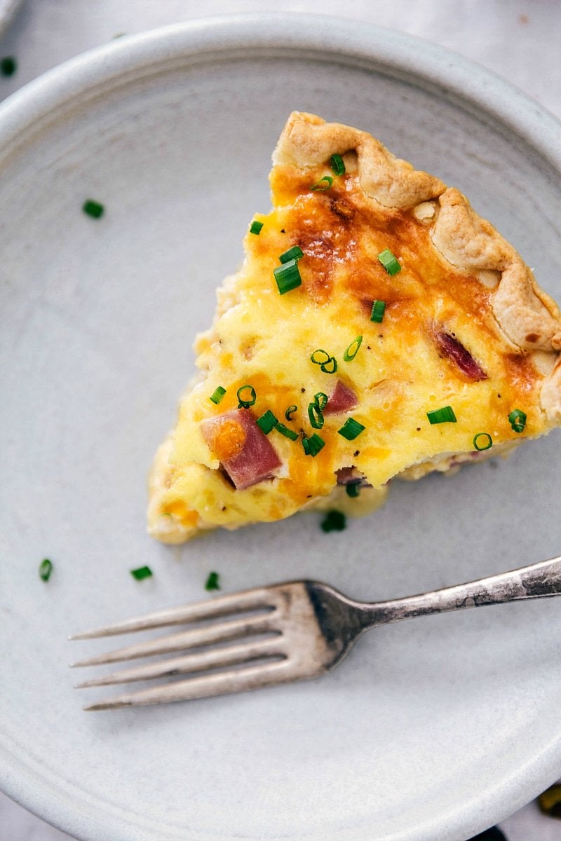 Serving a Slice of Homemade Ham and Cheese Quiche Slice of scrumptious ham and cheese quiche.
