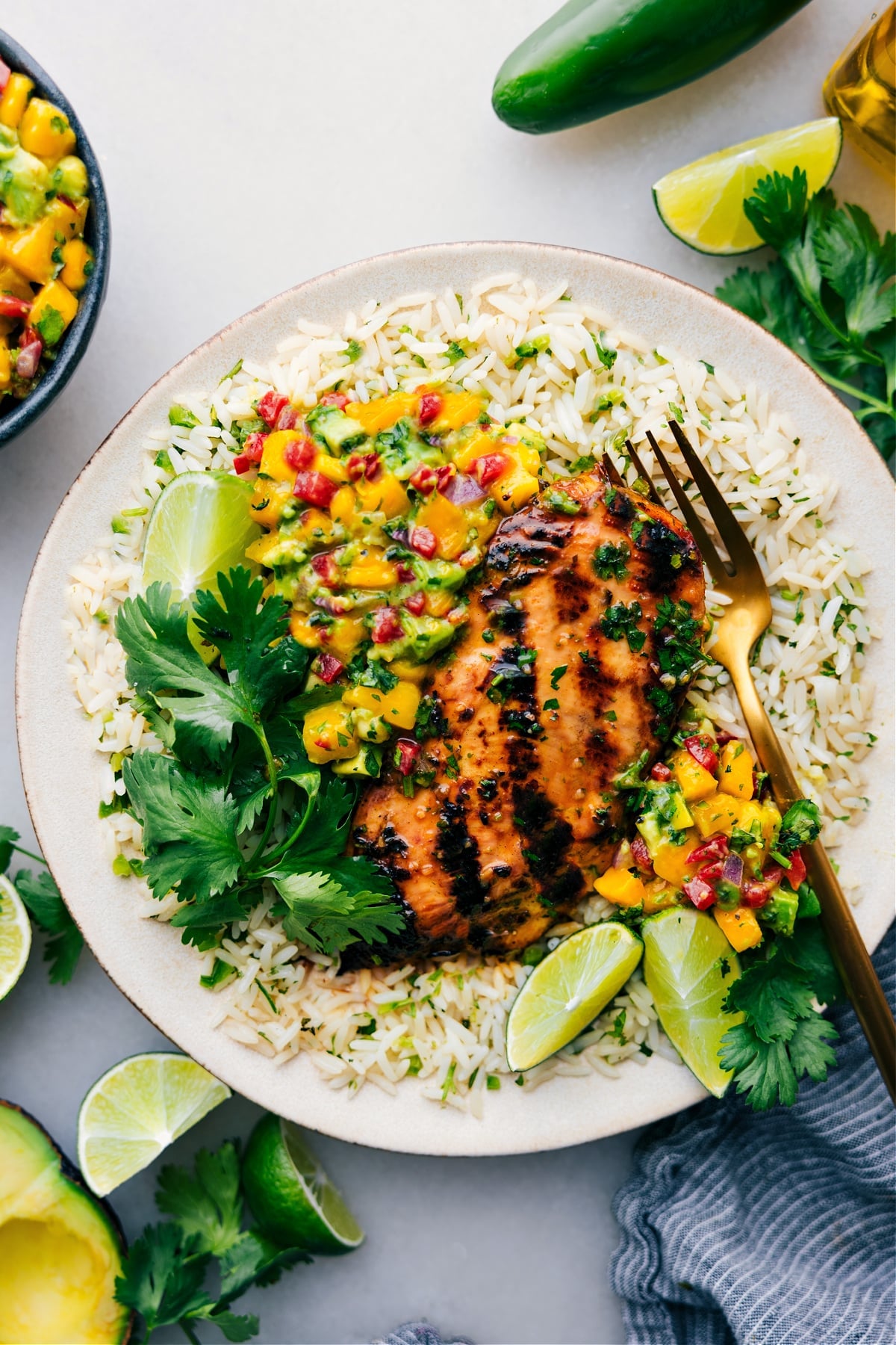 The Best Cilantro Lime Chicken Recipe Cilantro Lime Chicken on a bed of rice with fresh salsa.