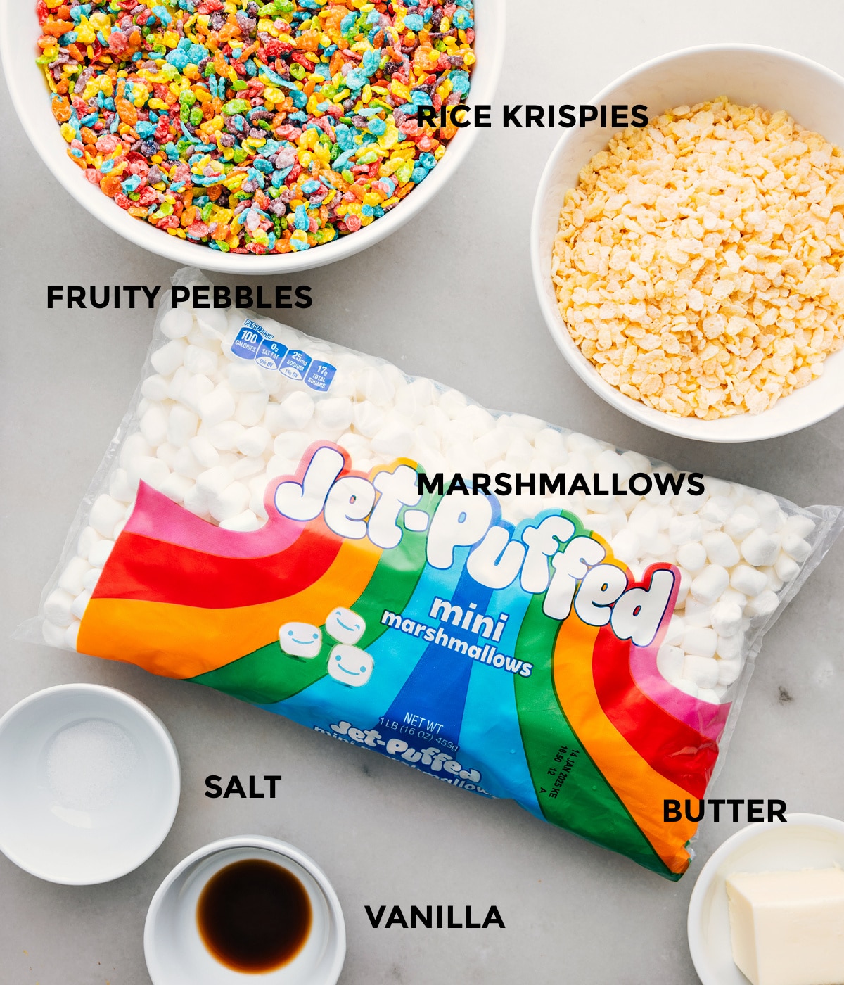 Ingredients In Fruity Pebble Rice Krispie Treats The ingredients in this recipe prepped out for easy assembly including the cereal, marshmallows, salt, vanilla, and butter.