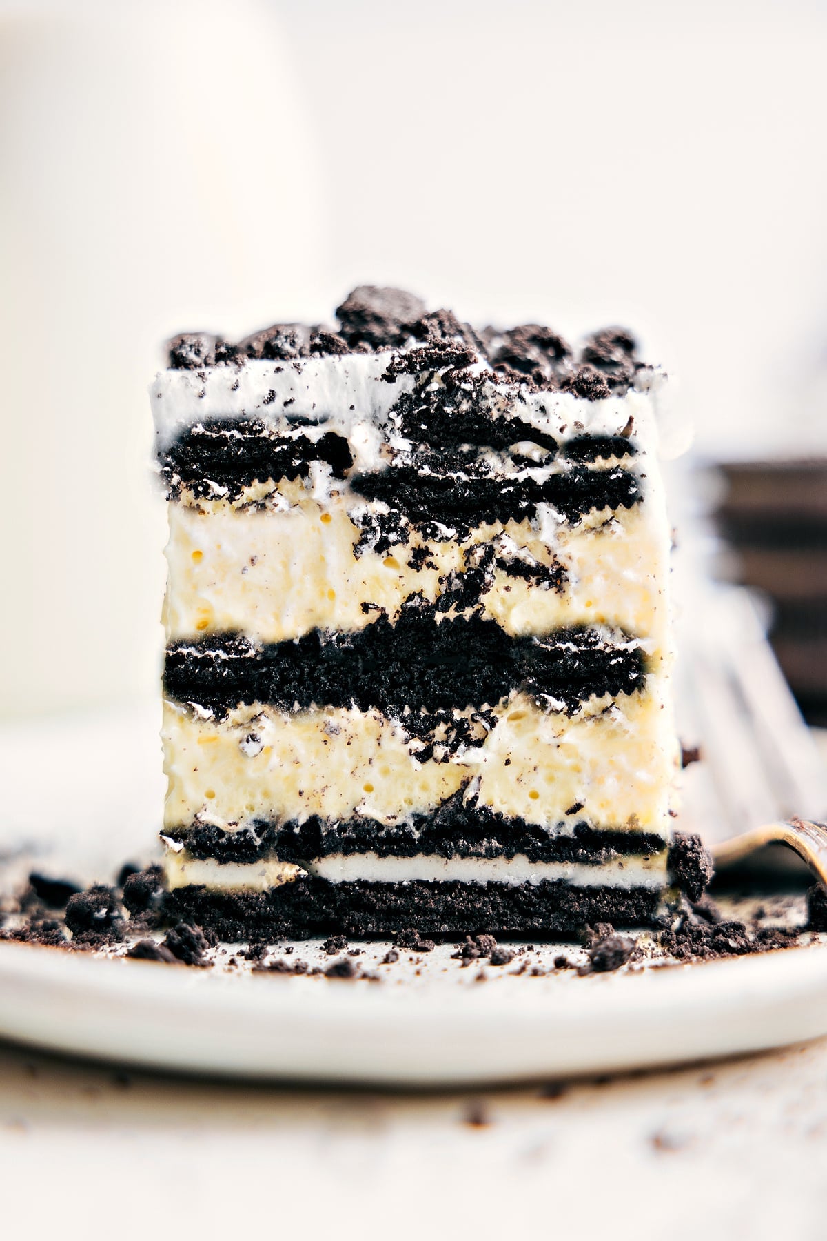 Simple And Delicious Oreo Icebox Cake Recipe Oreo Icebox Cake square on a plate, ready to be enjoyed.