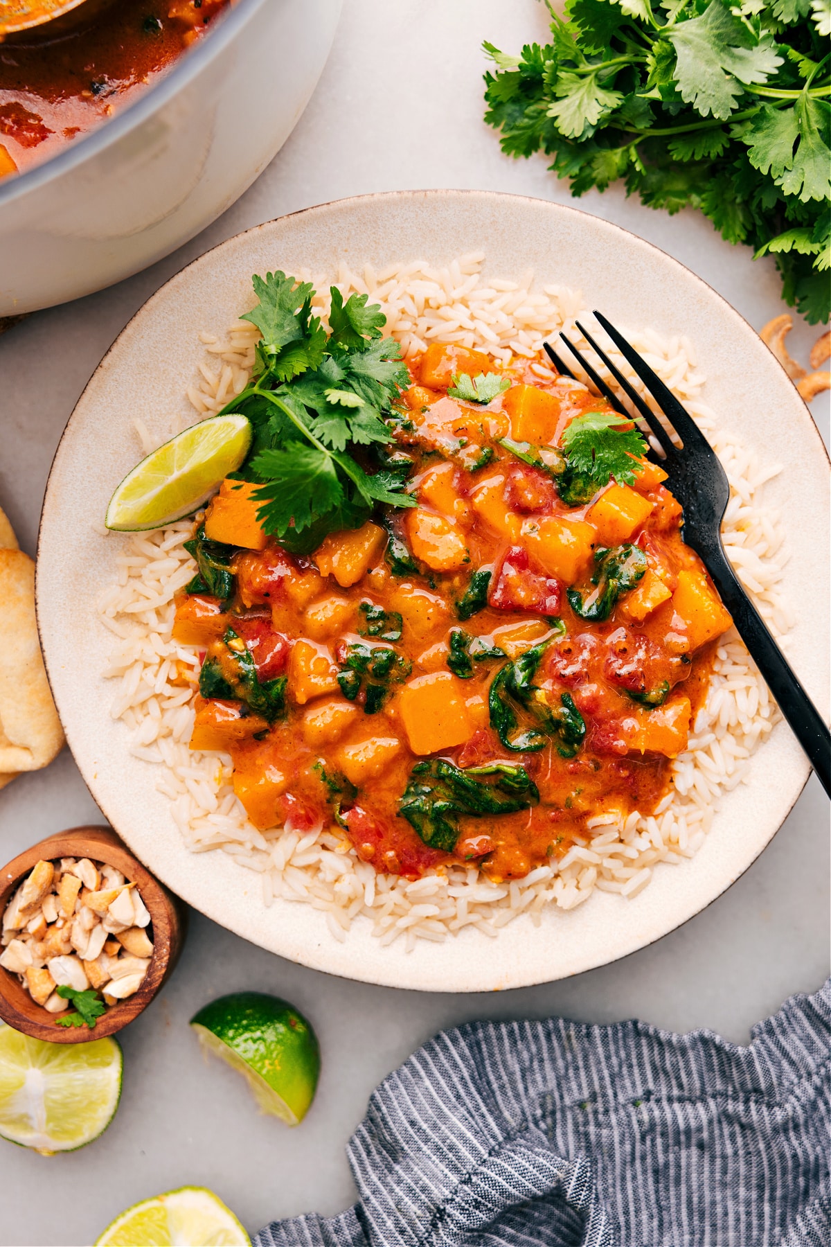 The Best Butternut Squash Curry Recipe Serve butternut squash curry on a bed of rice, and top it with cilantro and lime.