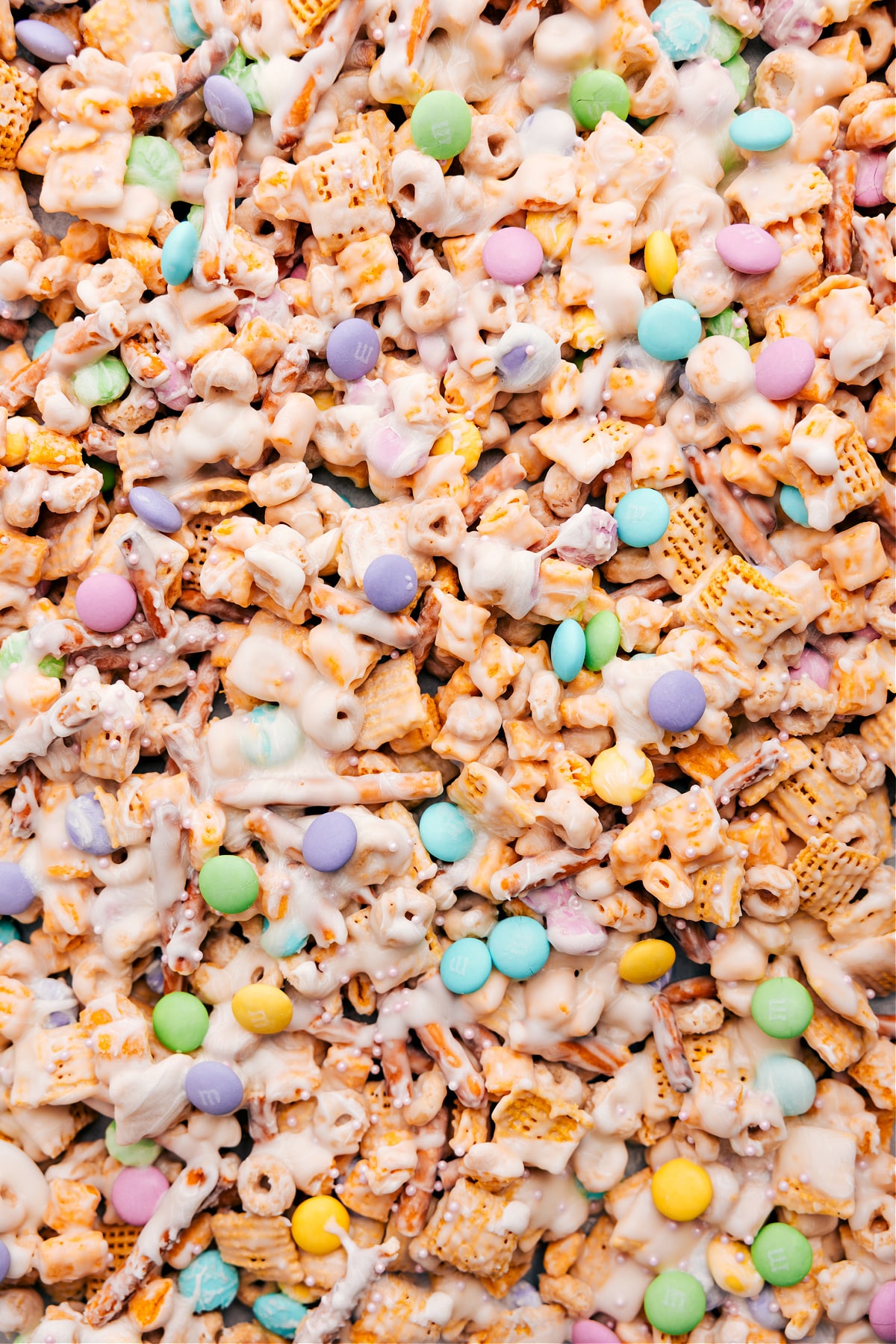 Bunny Bait recipe spread on the pan, topped with sprinkles and spring M&Ms.