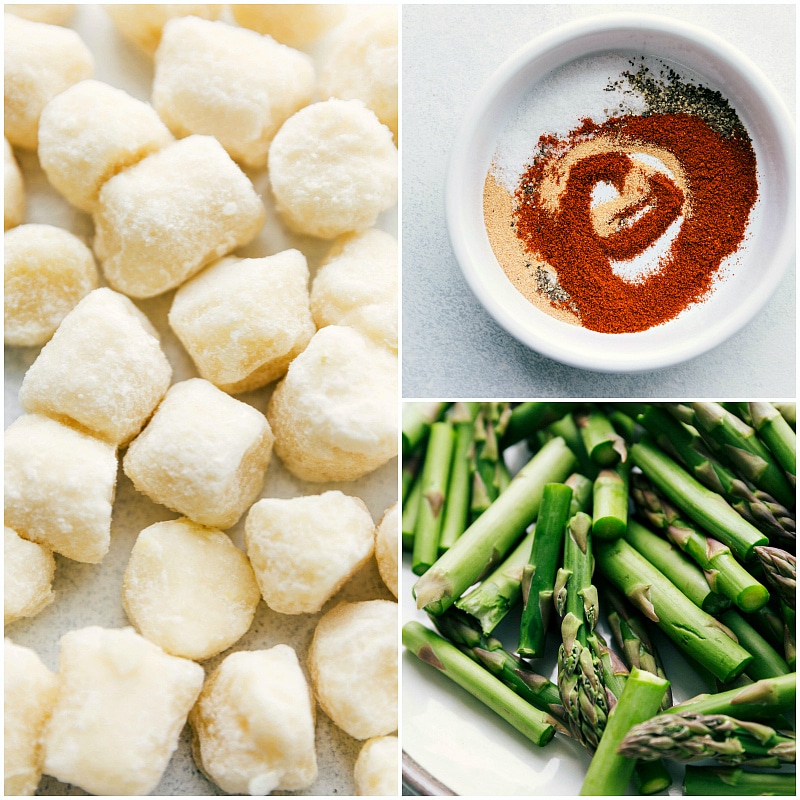 Sausage Pesto and Veggies is sure to be a hit!ย chelseasmessyapron.com #one #pan #easy #recipe #sausage #pesto #asparagus #chicken #sundried #tomatoes Process shot of frozen cauliflower gnocchi, cut up asparagus, and an easy seasoning mix.