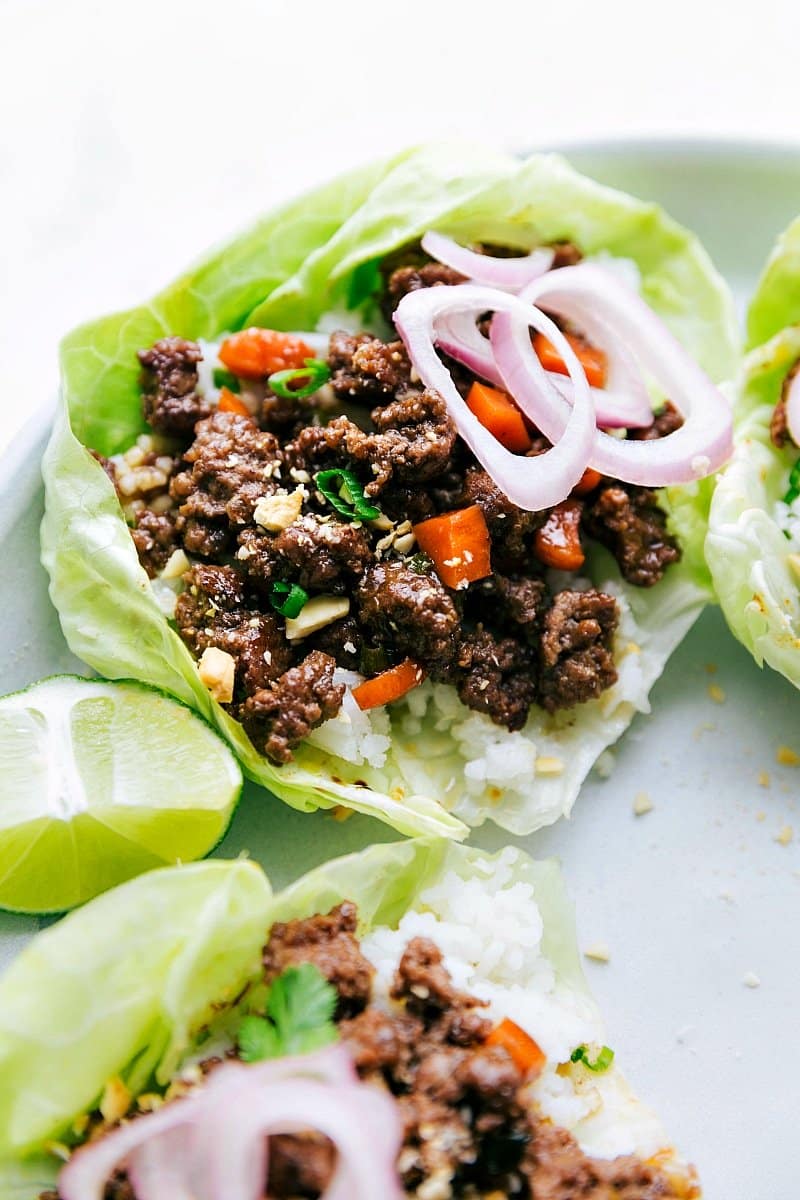 The finished beef lettuce wraps, beautifully presented with fresh toppings and packed with delicious, savory flavor.