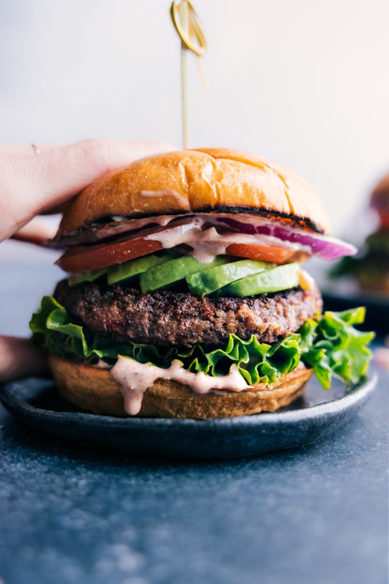 Black Bean Burger REcipes Vegetarian recipes: black bean burger with fresh veggies on a buttered bun.