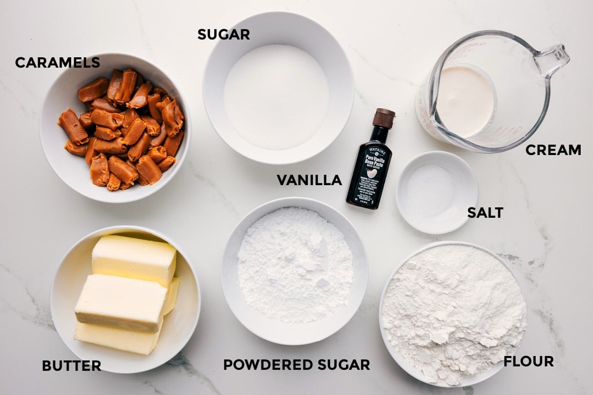 Ingredients In Caramel Cookie Bars All the ingredients in this recipe prepped out for easy assembly including the caramels, butter, sugar, powdered sugar, vanilla, cream, salt, and flour.