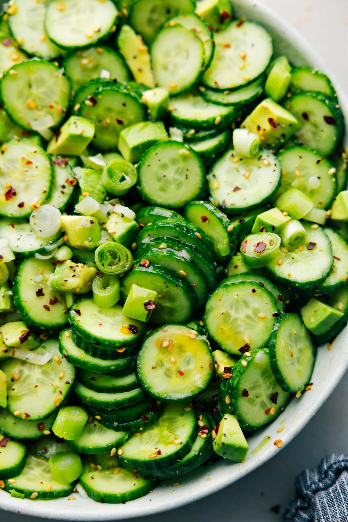 How To Make Asian Cucumber Salad Asian Cucumber Salad in a bowl dressed and tossed together for a light side dish.