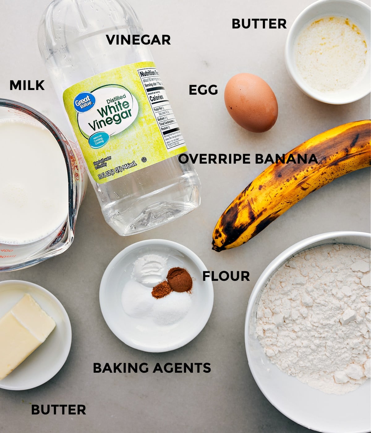 Prepped Ingredients for Banana Pancake Recipe: Bananas, Flour, Eggs, Syrup, and More All ingredients for the banana pancake recipe prepped and laid out for easy assembly, including bananas, flour, eggs, and syrup.