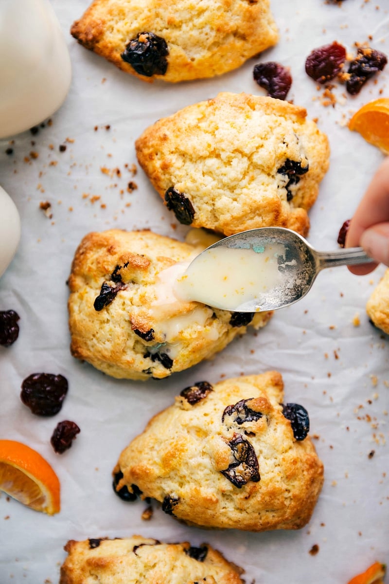Adding Glaze to Golden-Brown Desserts - Enhancing Flavor and Presentation Applying a sweet glaze to the top of the golden-brown desserts, making them even more enticing and ready to be enjoyed.