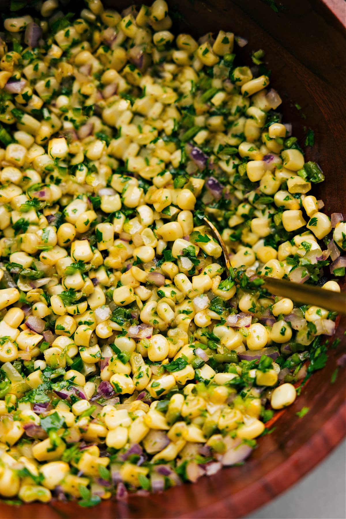 Up close photo of Chipotle Corn Salsa with spoon in it Up close photo of Chipotle Corn Salsa with spoon in it