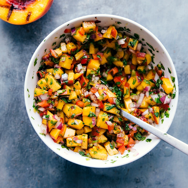 Bowl of Freshly Mixed Peach Salsa - Colorful and Flavorful Fresh and delicious chicken with peach salsa, with all ingredients mixed together in a bowl.