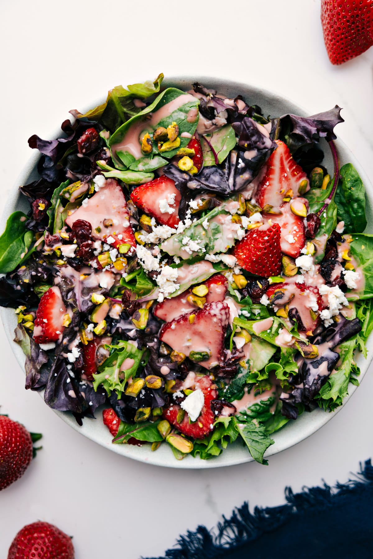 The Absolute Best Strawberry Vinaigrette Recipe A big salad tossed together and drizzled with this delicious dressing.
