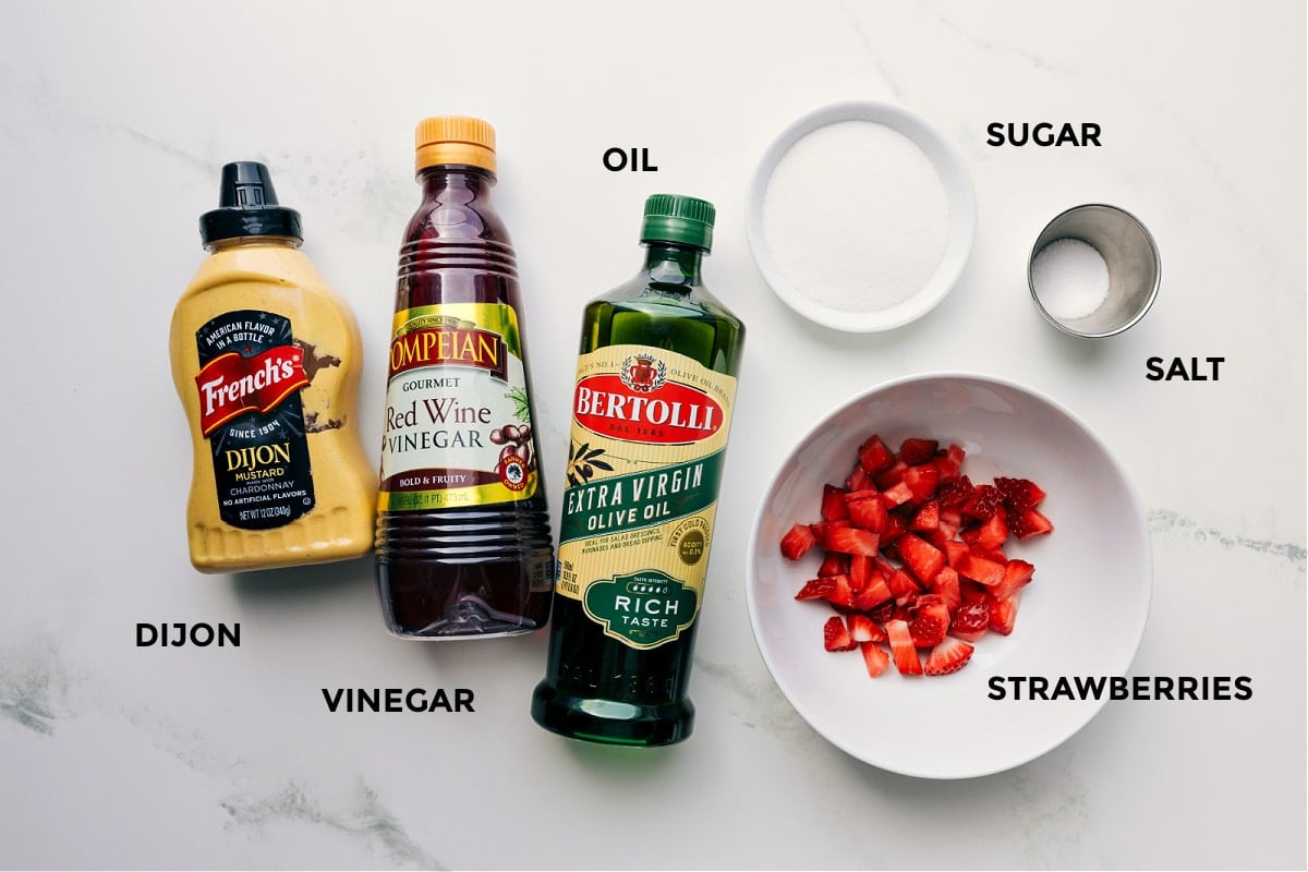Ingredients In Strawberry Vinaigrette All the ingredients in this recipe prepped and ready to go, including strawberries, sugar, salt, oil, red wine vinegar, and Dijon.