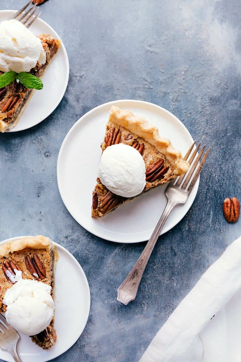 Delicious Pecan Pie Slices with Ice Cream, Mint, and Fork - Dessert Ready to Enjoy Slices of pecan pie with ice cream, mint, a tempting dessert delight.
