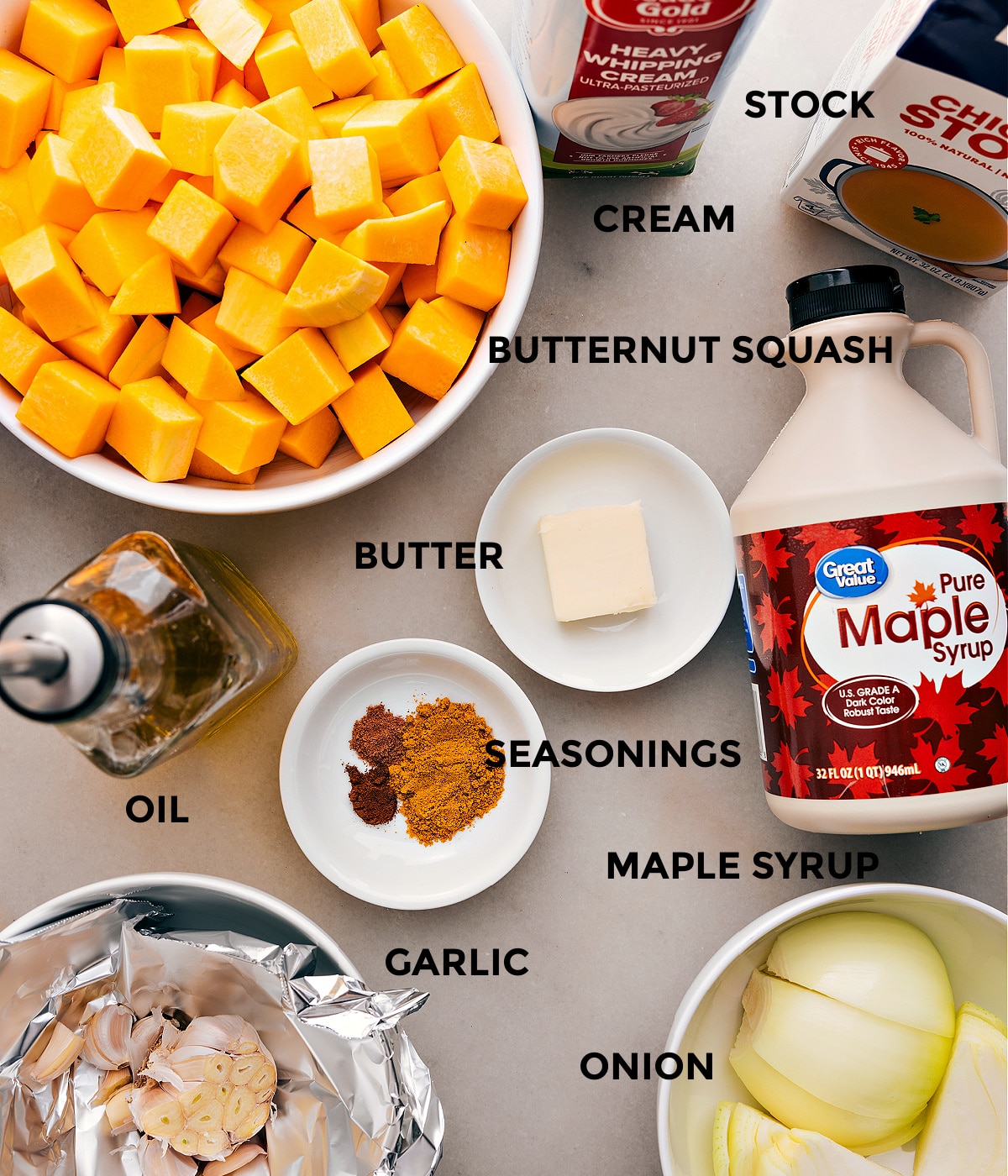 Ingredients In Butternut Squash Soup Prep all the ingredients for this recipe, including the veggies, stock, cream, maple syrup, butter, seasoning, and oil, for easy assembly.