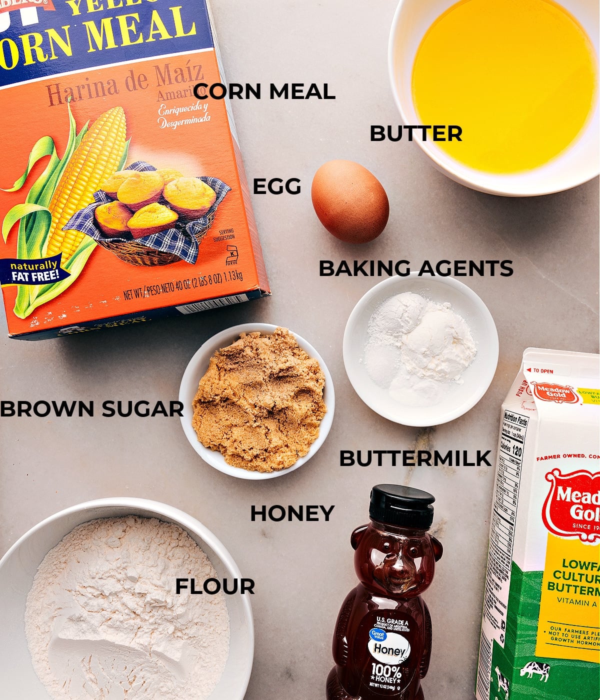 Ingredients for Cornbread Muffin Recipe: Corn Meal, Brown Sugar, Flour, Buttermilk, and More Ingredients for cornbread muffin recipe displayed, including corn meal, brown sugar, flour, buttermilk, and more.