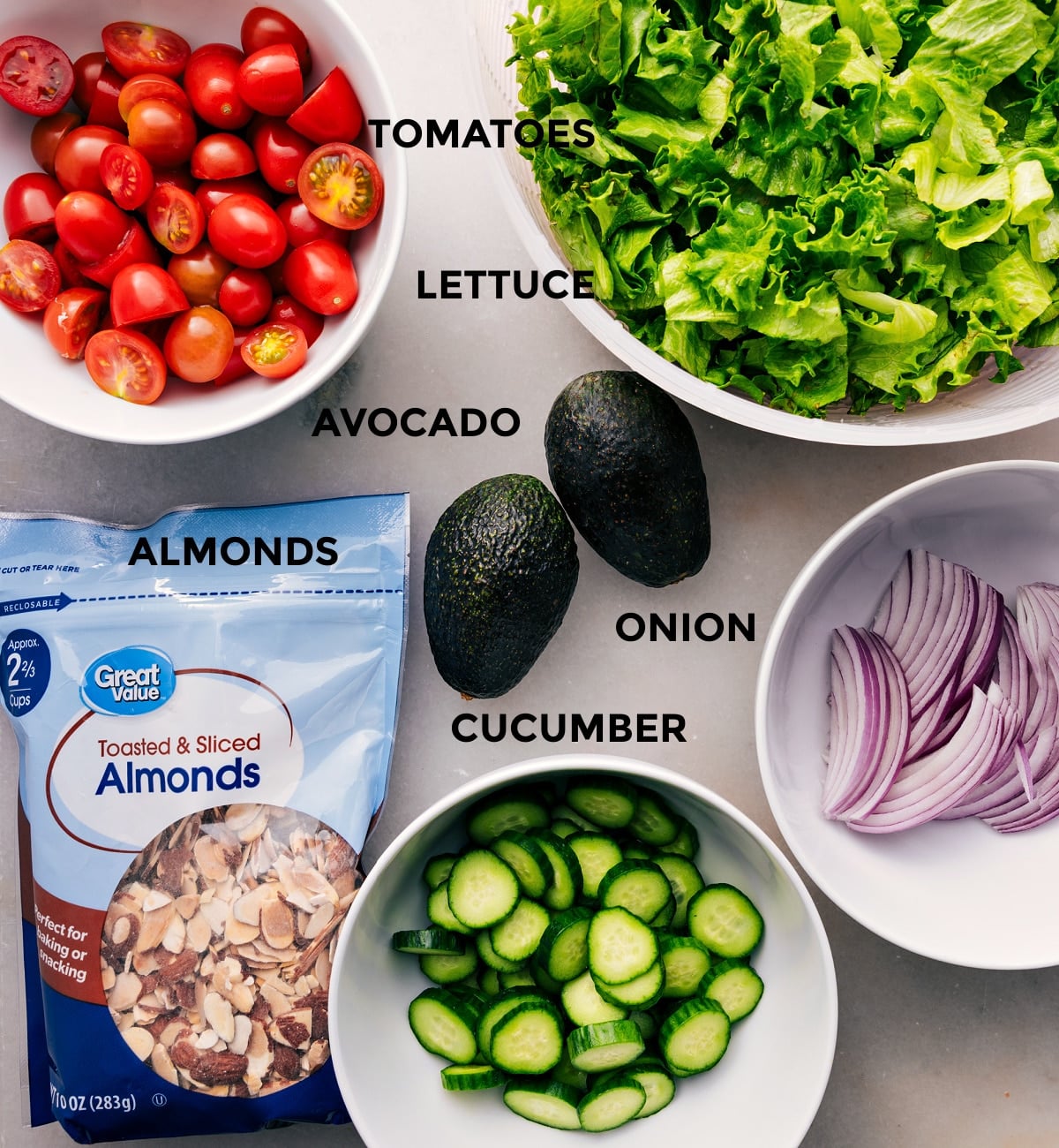 Ingredients In Crispy Chicken Salad This recipe uses prepped ingredients for easy assembly: lettuce, tomatoes, avocado, onion, cucumber, and almonds.