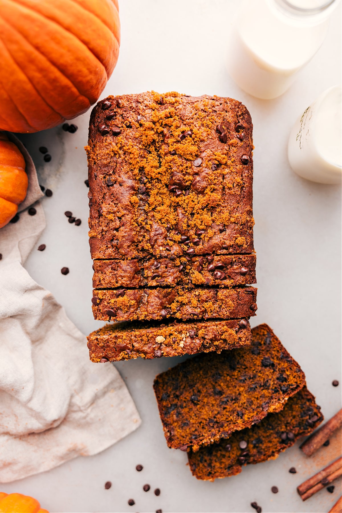 Sliced Pumpkin Chocolate Chip Bread: Moist and Fluffy Interior Pumpkin chocolate chip bread with slices cut out, revealing the delicious and fluffy interior.