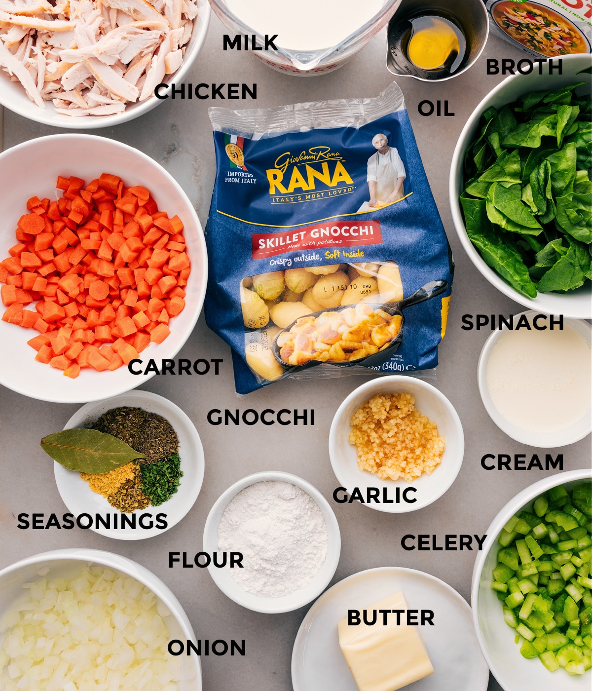 Ingredients In Chicken Gnocchi Soup All the ingredients for this recipe are prepped for easy assembly, including the veggies, gnocchi, broth, oil, milk, garlic, celery, cream, and seasonings.