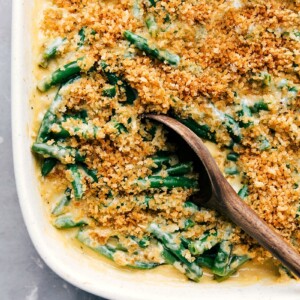 Ready-to-eat green bean casserole in a pan, showcasing its crisp top.