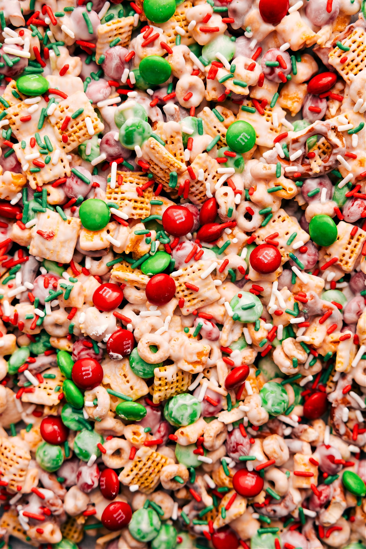 Festive and fun Christmas Snack Mix with M&Ms and sprinkles ready to be enjoyed.