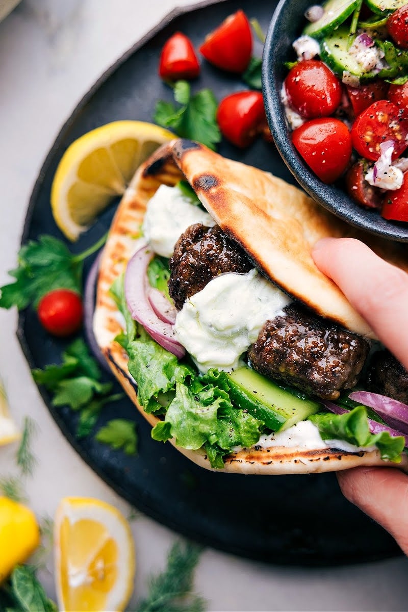 Greek Meatball Recipe In A Pita Greek recipes: Greek meatballs tucked into warm pita bread and topped with creamy tzatziki sauce.