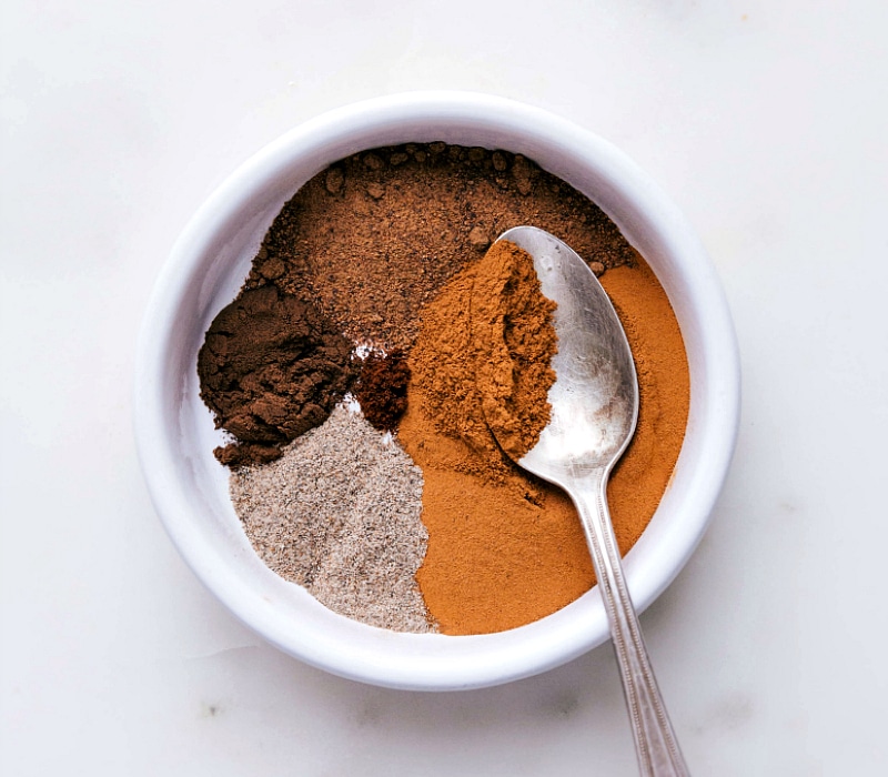 Ingredients for Homemade Apple Pie Spice Recipe in a Bowl Bowl filled with ingredients for homemade apple pie spice recipe, ready for blending.