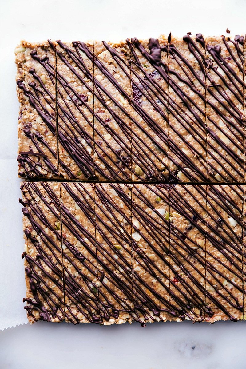 Delicious No-Bake Granola Bars with Chocolate Drizzle Gorgeous no-bake granola bars with chocolate drizzled over the top.