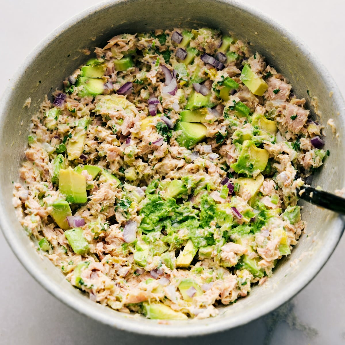 Quick And Simple Avocado Tuna Salad The Avocado Tuna Salad is tossed together in a bowl, ready to be served on bread as a sandwich or enjoyed however you like.